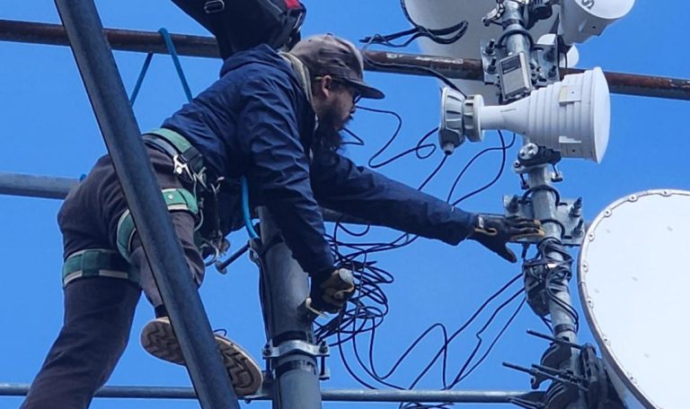 a Surfnet employee installing internet hardware