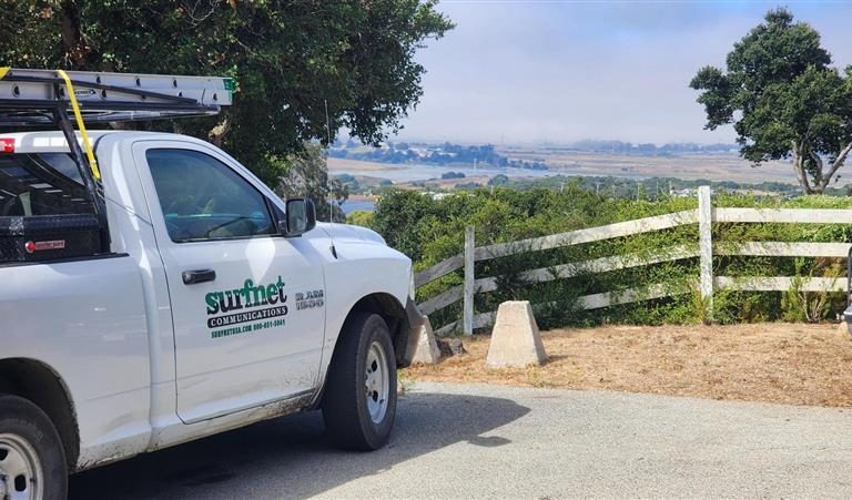 A surfnet truck parked on an overlook